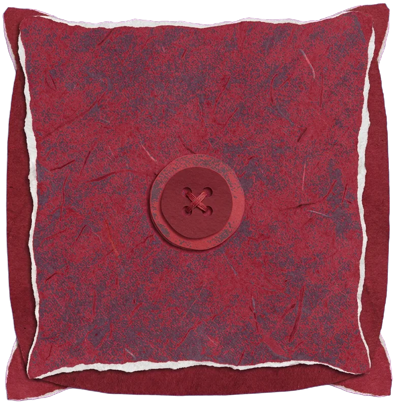 A cushion in felt-red paper, button and all.